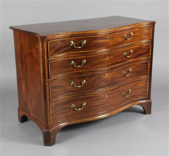 A George III satinwood banded mahogany serpentine commode, W.3ft 5in. D.1ft 9in. H.2ft 7in.
